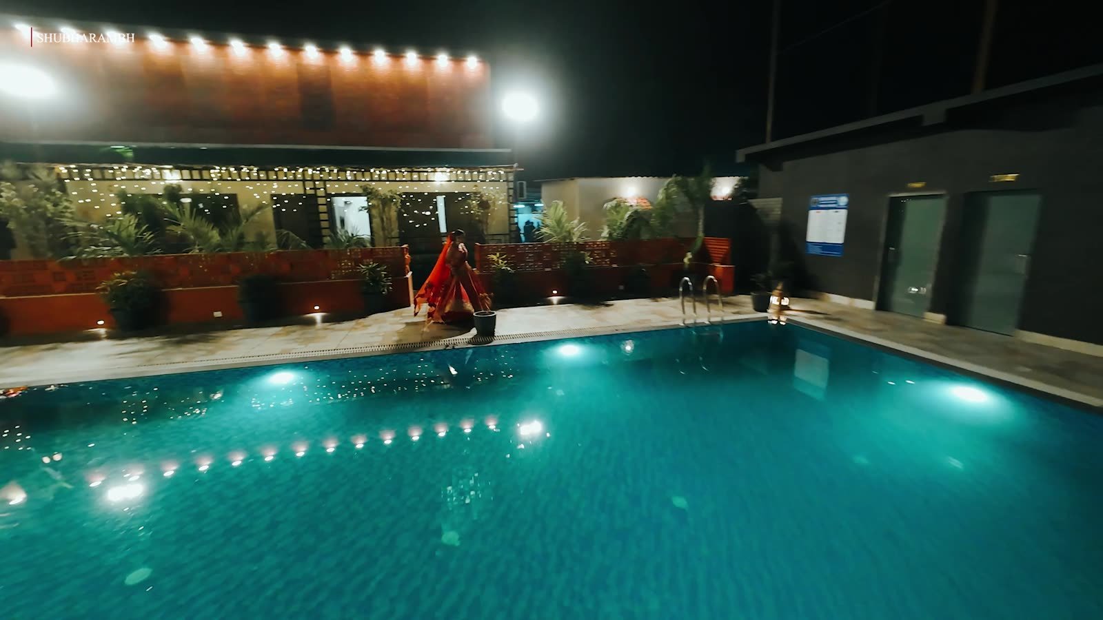 Candle-lit pool at night