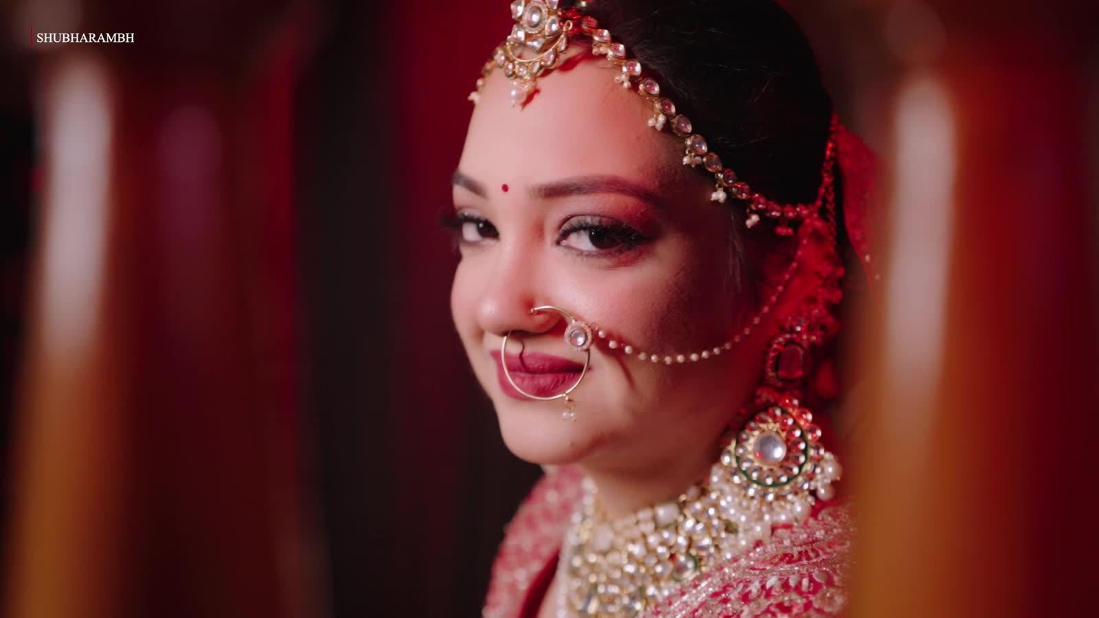 Bridal portrait between red pillars